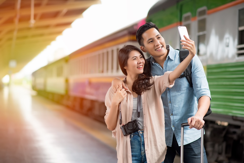 young couple at the train station